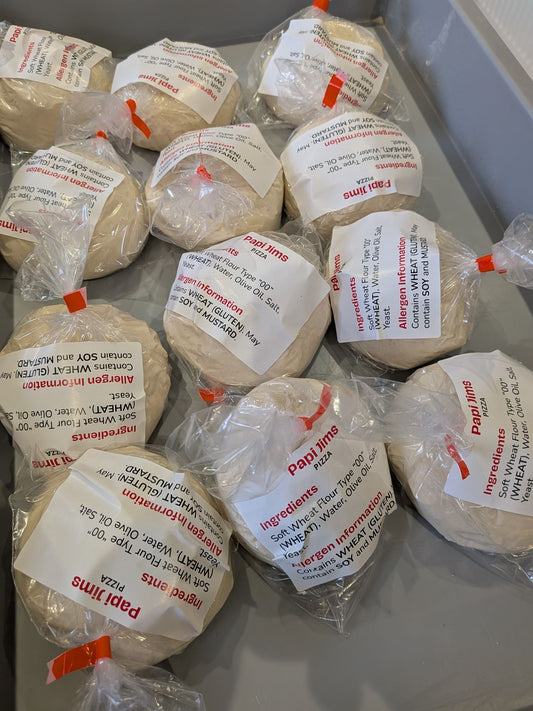 Papi Jim's dough balls bagged and labelled in a tray