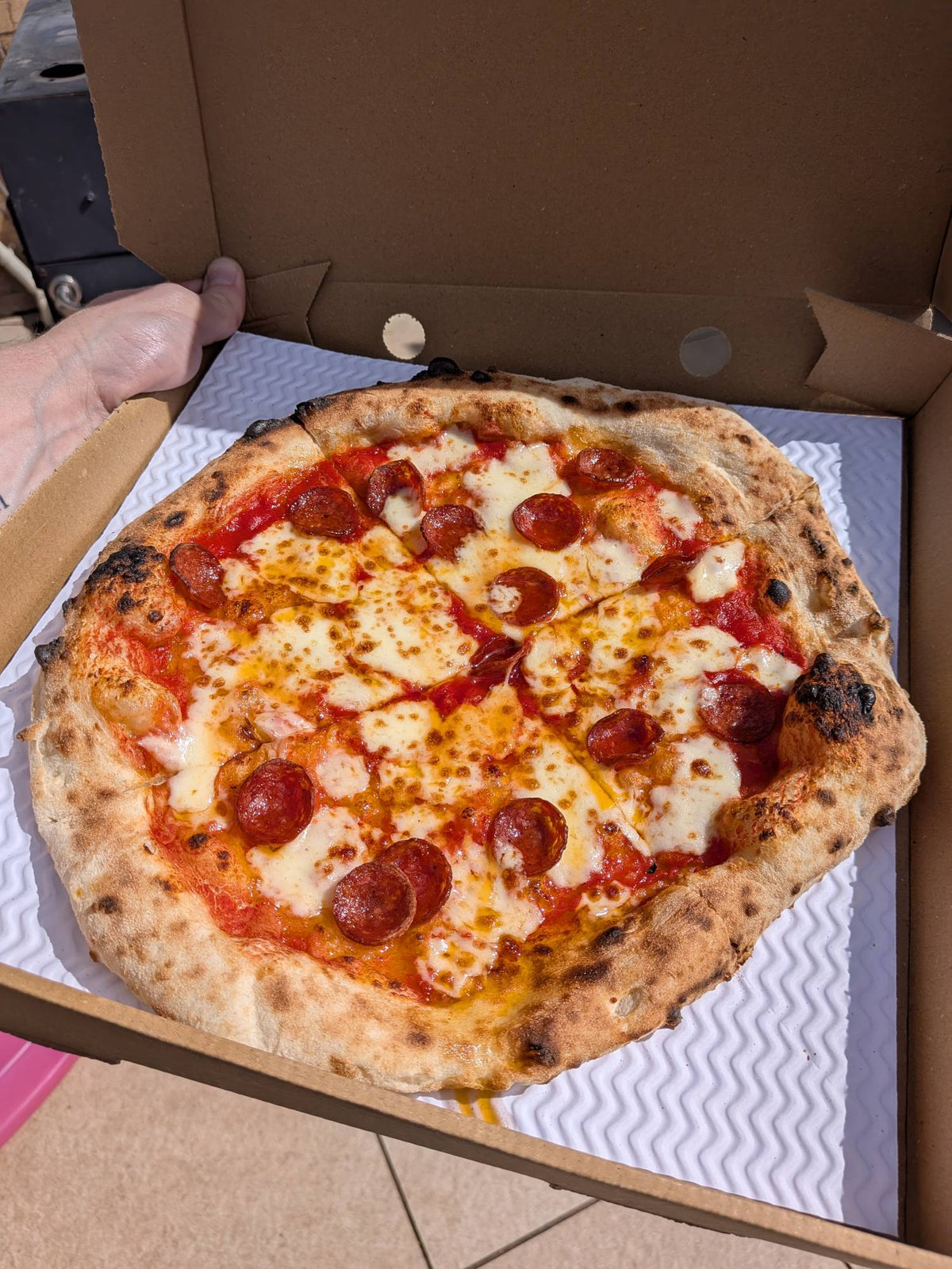 A pepperoni pizza made from Papi Jim's dough, fresh out of the oven